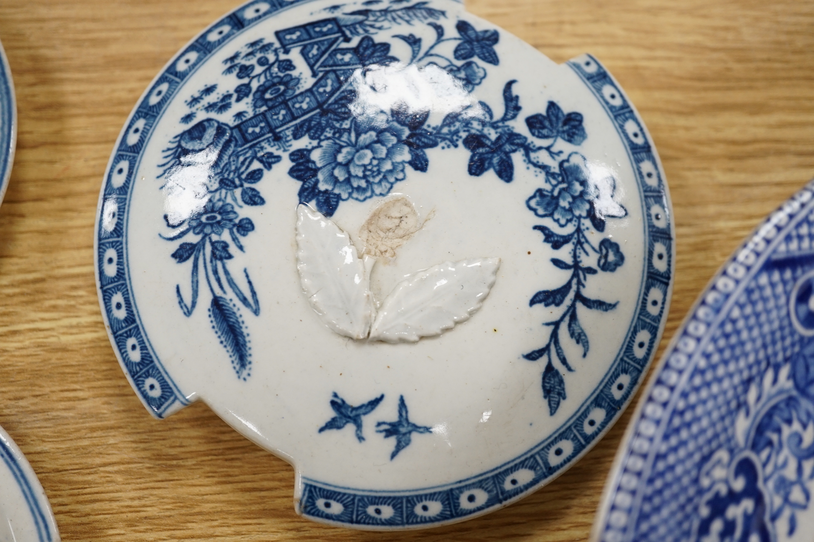 A 19th century Abbotsford pattern blue and white tureen and cover, various dishes and a collection of early Worcester tea and coffee pot covers